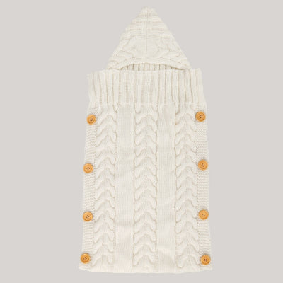 nid d'ange tricoté blanc pour bébé