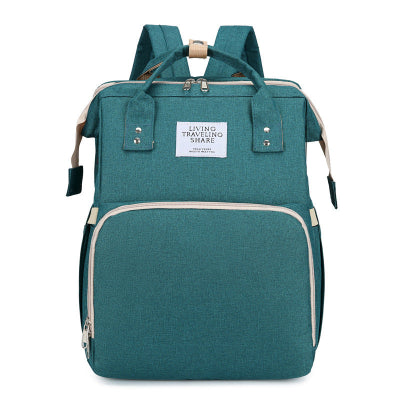 sac à langer vert - lit bébé de voyage